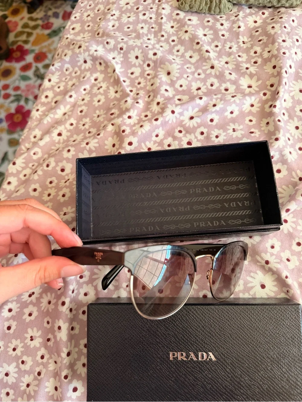Prada Women’s Black Sunglasses with Gold Trim